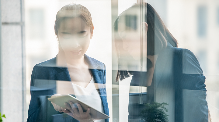 Reflection of two woman discussing 