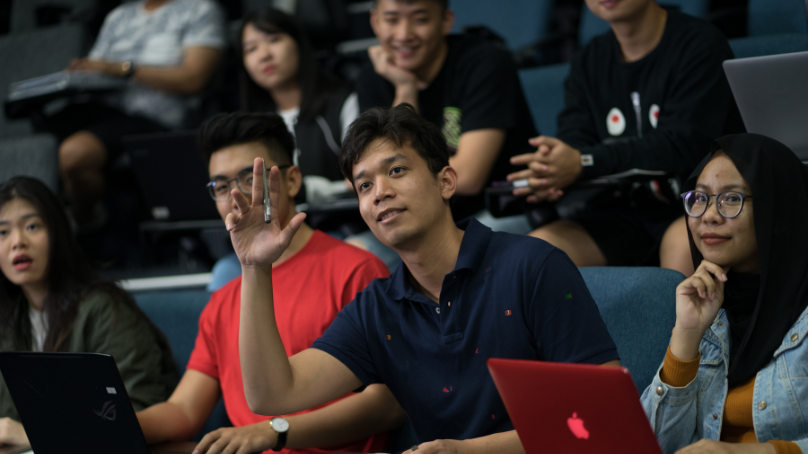 student asking a question during a lecture